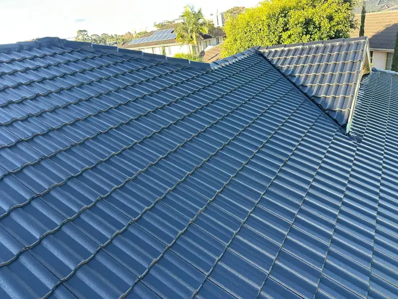 Finished blue-grey tile roof after restoration