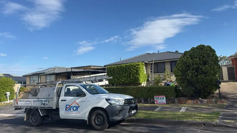 Brar Roofing Solution ute parked outside a roofing job