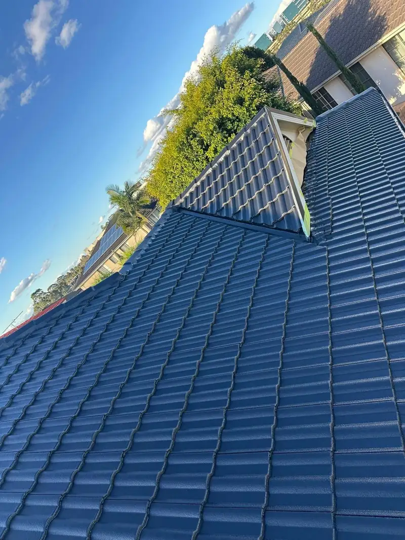 Roof valley on a restored blue tile roof